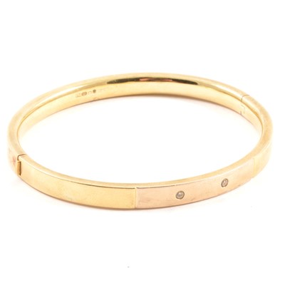Lot 181 - A yellow metal half hinged bangle.