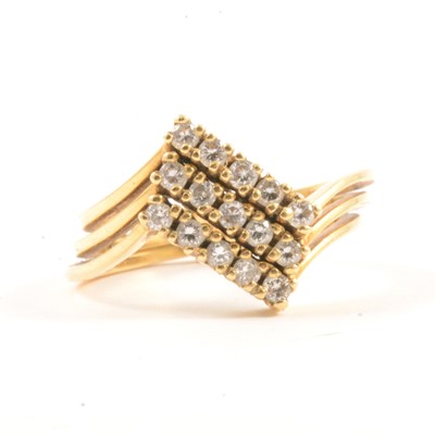 Lot 19 - A diamond puzzle ring.