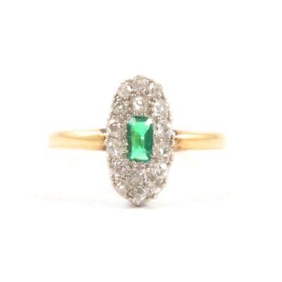 Lot 73 - A diamond cluster ring with synthetic green stone.