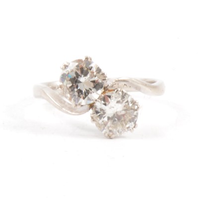 Lot 12 - A diamond two stone crossover ring.