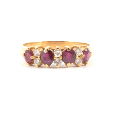 Lot 67A - A ruby and diamond half hoop ring.