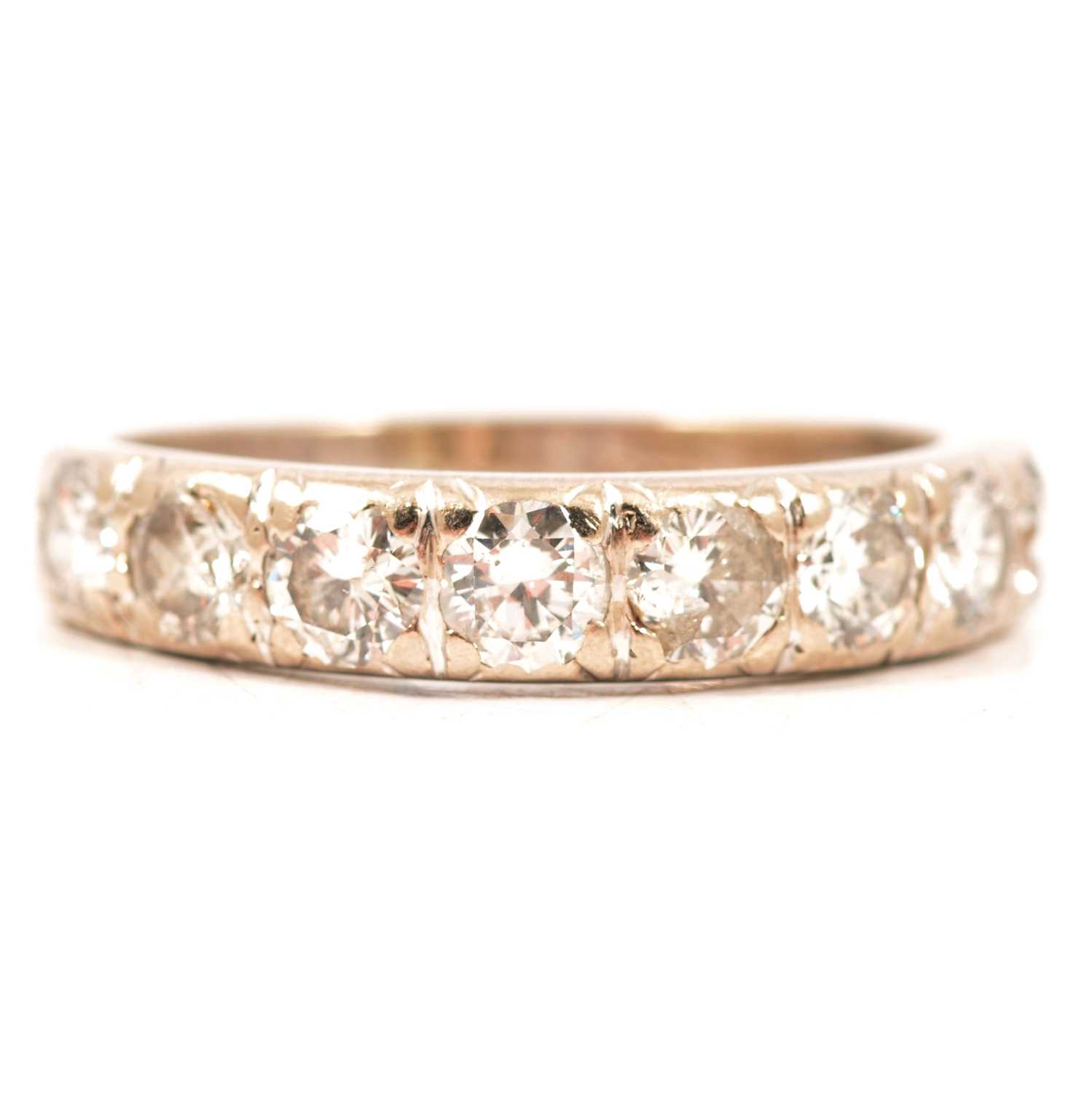 Lot 16 - A diamond half eternity ring.