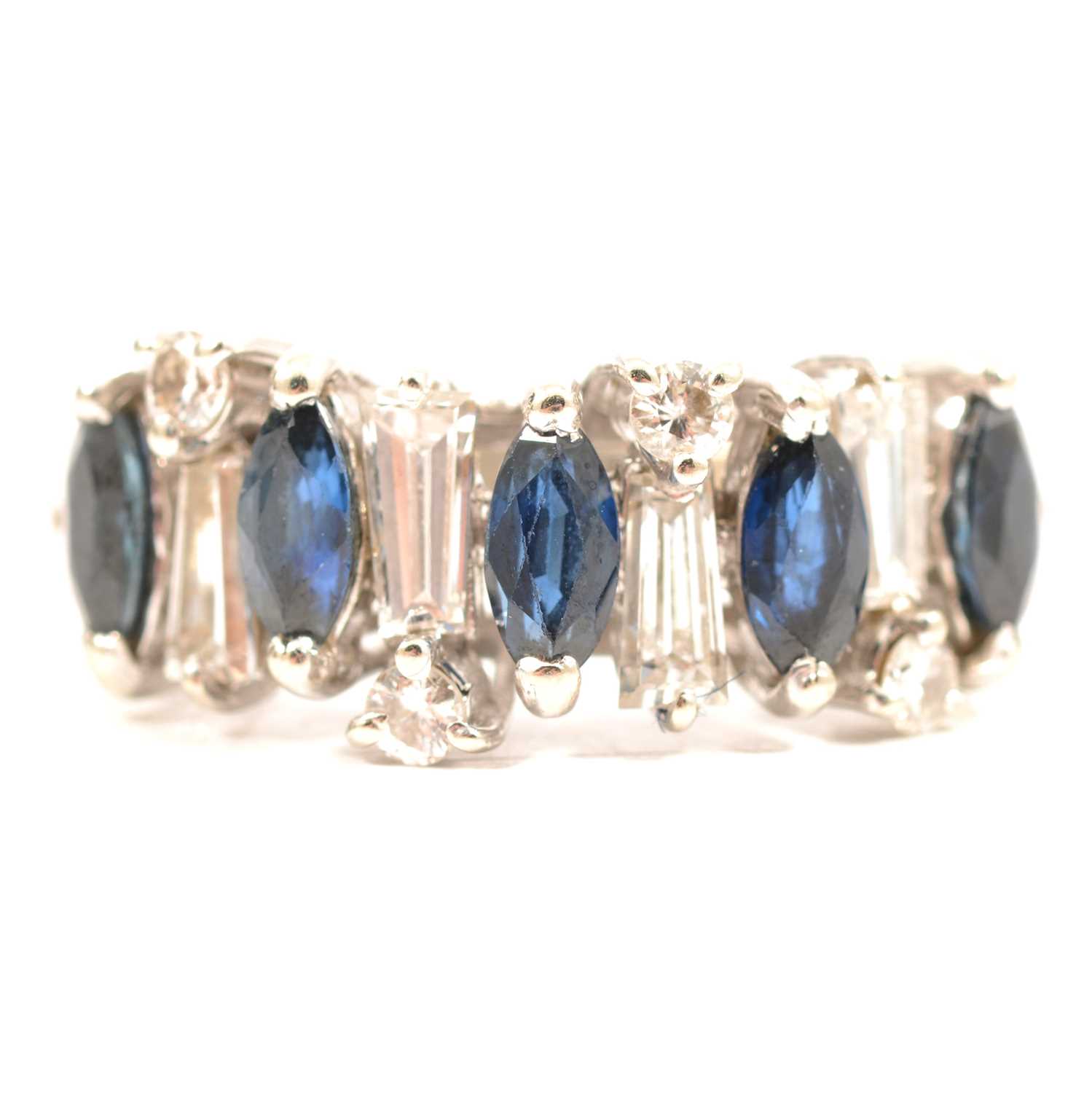 Lot 22 - A sapphire and diamond half hoop ring.