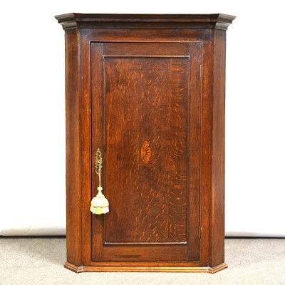 Lot 307 - George III oak hanging corner cupboard