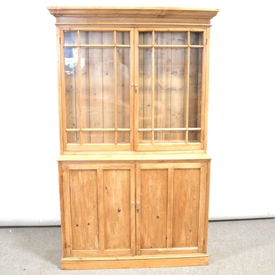 Lot 336 - Stripped pine bookcase cabinet