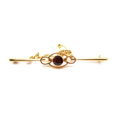 Lot 145 - A garnet and pearl bar brooch.