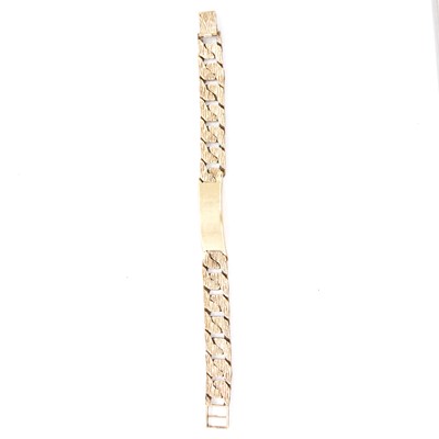 Lot 172 - A 9 carat yellow gold bark textured identity bracelet.