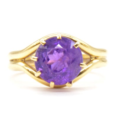 Lot 76 - An amethyst dress ring.