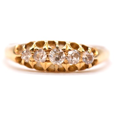 Lot 58 - A diamond five stone ring.