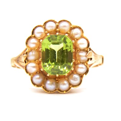 Lot 56 - A peridot and pearl cluster ring.