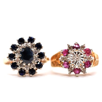 Lot 81 - A sapphire and diamond reverse cluster ring and a ruby and diamond reverse cluster ring.