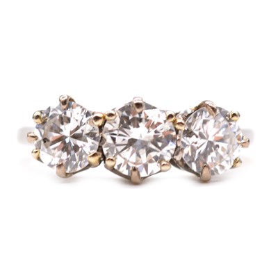 Lot 15 - A diamond three stone ring.