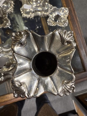 Lot 33 - Set of four George II cast silver candlesticks