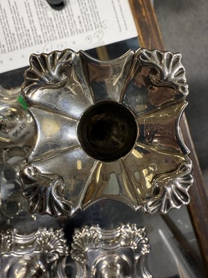 Lot 33 - Set of four George II cast silver candlesticks