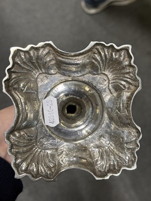 Lot 33 - Set of four George II cast silver candlesticks