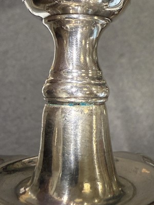 Lot 33 - Set of four George II cast silver candlesticks