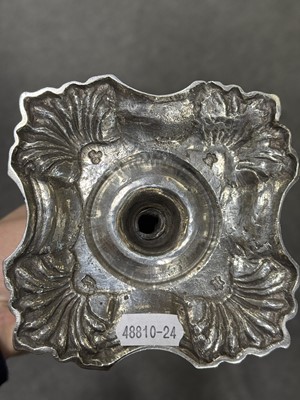 Lot 33 - Set of four George II cast silver candlesticks