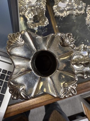 Lot 33 - Set of four George II cast silver candlesticks