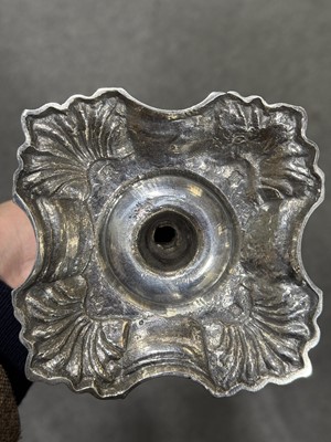 Lot 33 - Set of four George II cast silver candlesticks