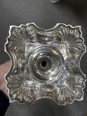 Lot 33 - Set of four George II cast silver candlesticks