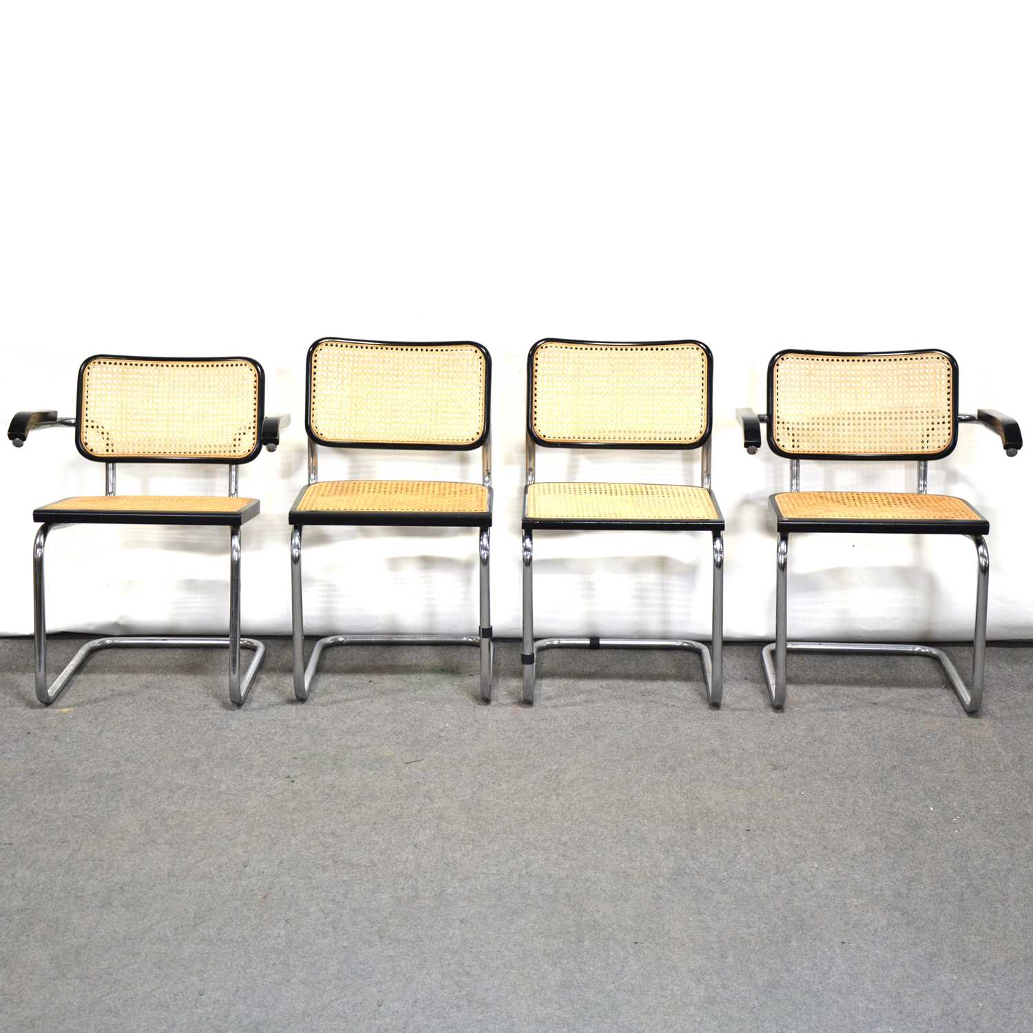 Lot 49 - Set of four chrome framed cantilevered chairs, and an ebonised circular pedestal table