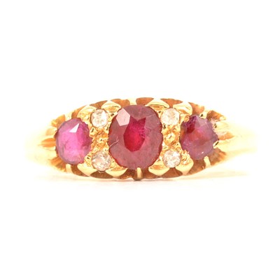 Lot 2 - A ruby and diamond half hoop ring.