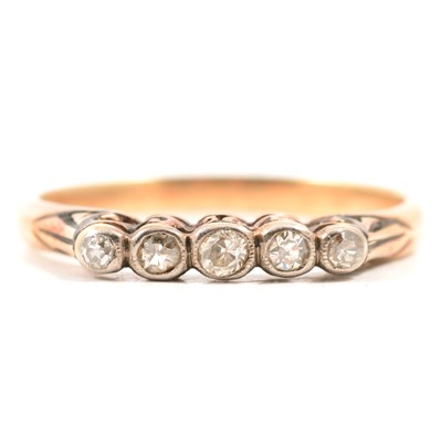 Lot 57 - A diamond five stone ring.