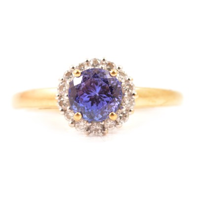 Lot 27 - A tanzanite and diamond cluster ring.
