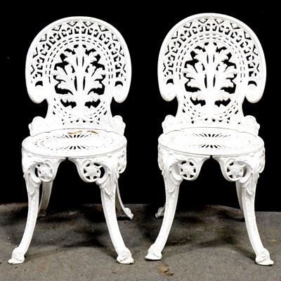 Lot 513 - Two white aluminium patio tables and four chairs
