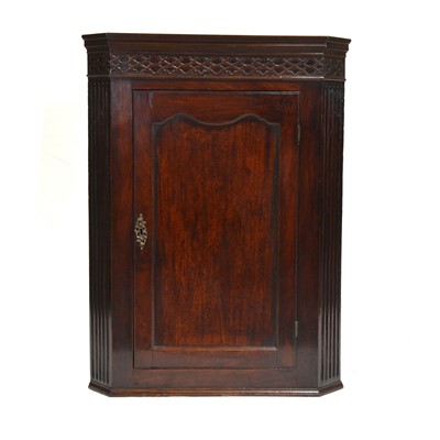 Lot 424 - George III mahogany hanging corner cupboard