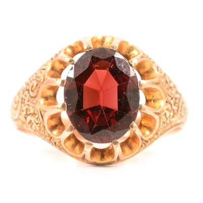 Lot 77 - A garnet solitaire ring.
