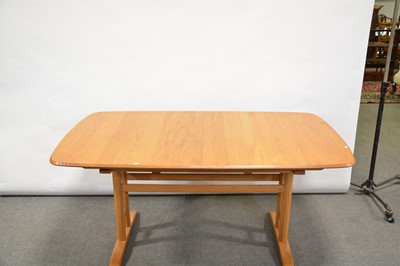 Lot 24 - A 'Burford' extending dining table with six Swan-back chairs, by Ercol