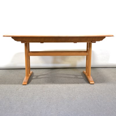 Lot 24 - A 'Burford' extending dining table with six Swan-back chairs, by Ercol