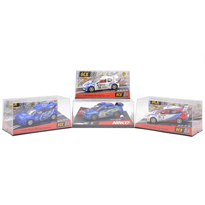 Lot 130 - Four SCX and Ninco slot cars, WRC vehicles, boxed