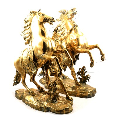Lot 217 - After Coustou, pair of large brass Marly horses