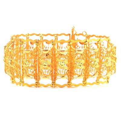 Lot 256 - A yellow metal filigree bracelet.