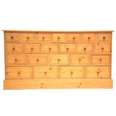 Lot 542 - Large bank of pine drawers