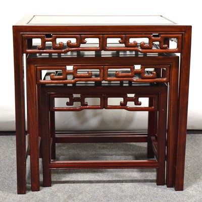 Lot 560 - Nest of three Chinese hardwood tables, mother of pearl inlaid, and a barrel seat