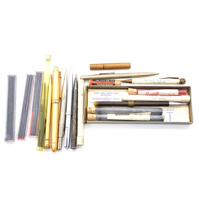 Lot 195 - A collection of pens, pencils and a motoring badge.