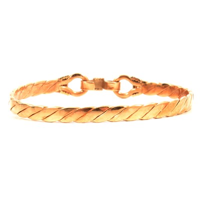 Lot 224 - A 9 carat yellow gold bangle.