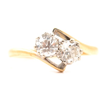 Lot 43 - A diamond two stone crossover ring.