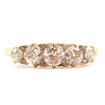 Lot 53 - A diamond five stone ring.