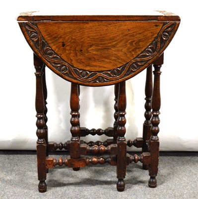 Lot 465 - Carved oak Sutherland table