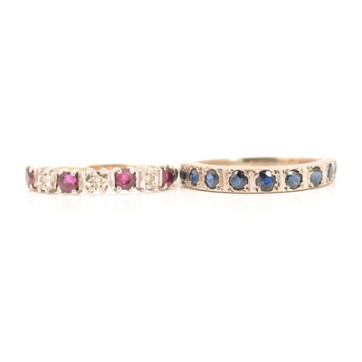 Lot 29 - Two coloured stone half eternity rings.
