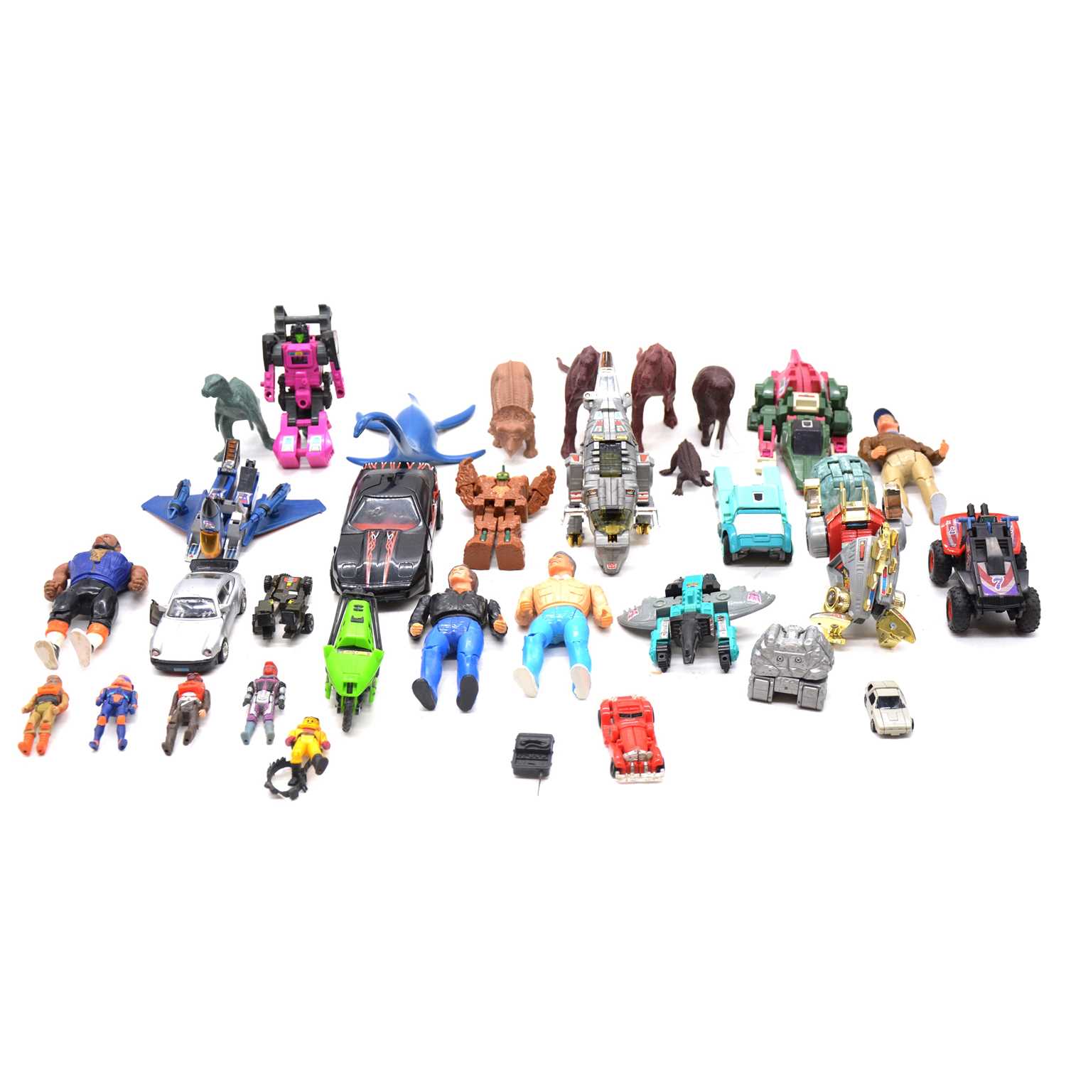 Lot 166 - A collection of action figures, including Transformers
