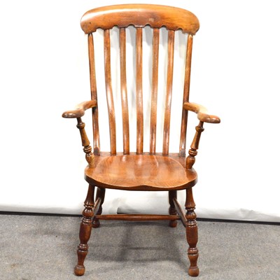 Lot 403 - Beechwood slat-back fireside armchair.