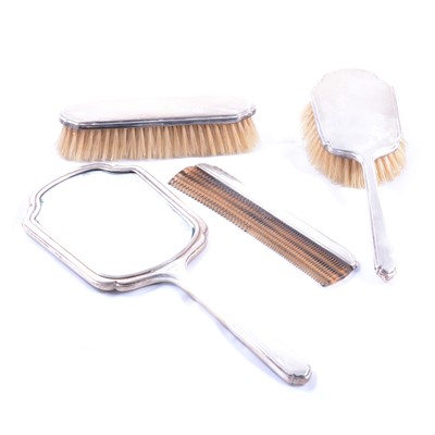 Lot 221 - Four-piece silver back dressing table set.