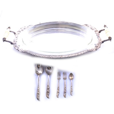 Lot 100 - A twin-handled silver-plated serving tray, on...