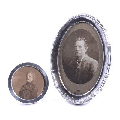 Lot 330 - Two silver strut back photograph frames.