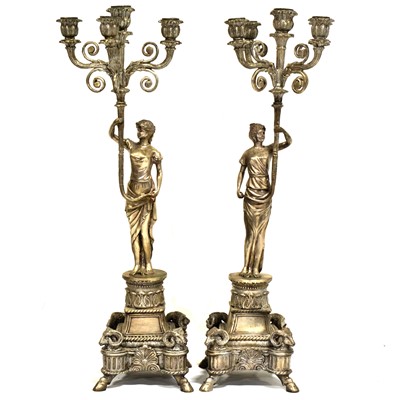 Lot 396 - Pair of large silvered metal figural candelabra